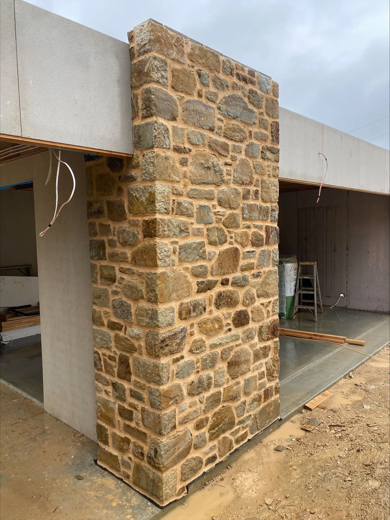 A stone column framing an open living room